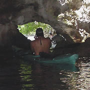 Sea canoeing through a cave